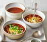 Smoky tomato, chipotle & charred corn soup in three bowls