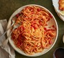 Spicy tomato spaghetti in a large bowl